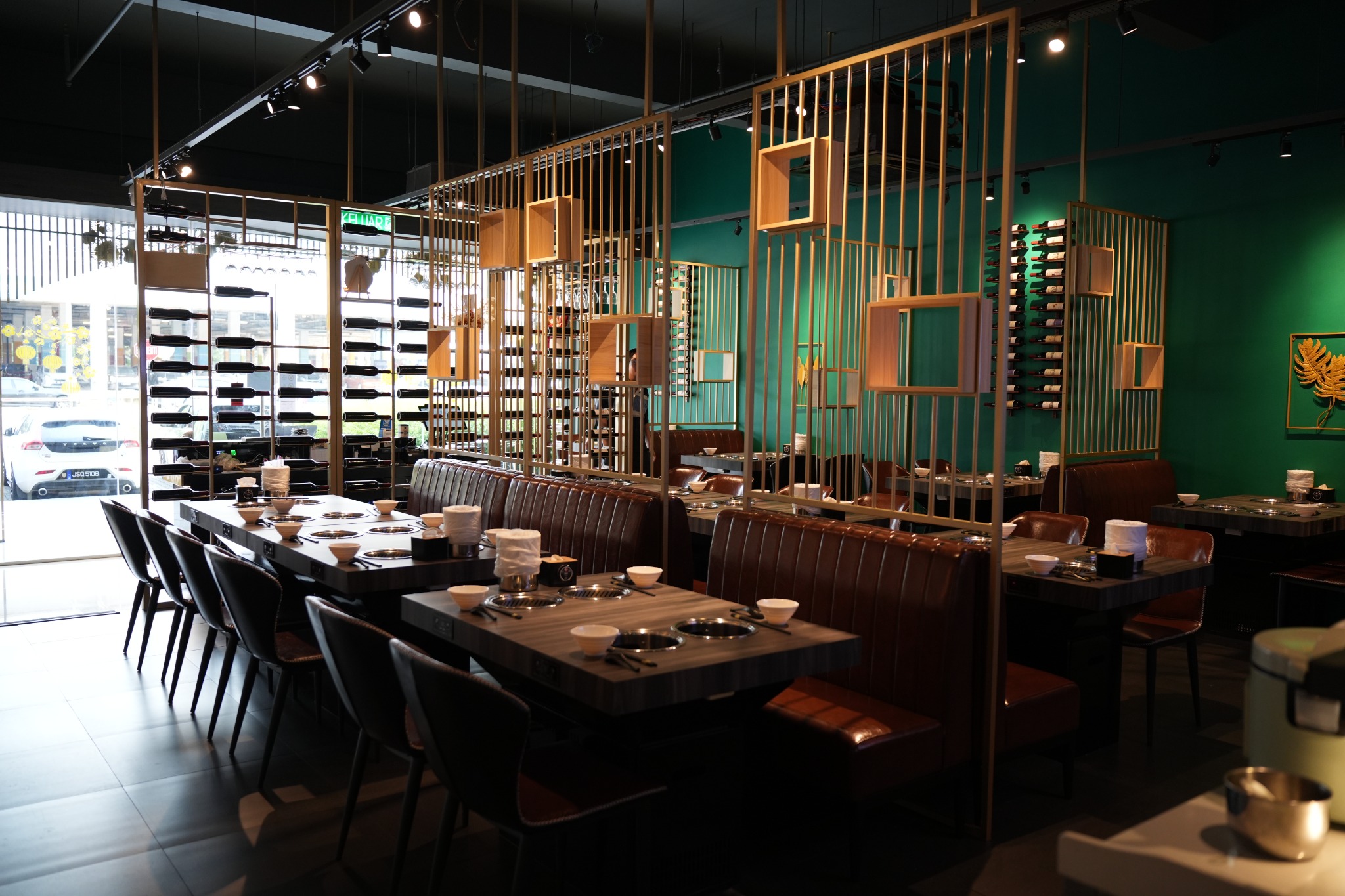 Warm restaurant seating with individual hot pot tables