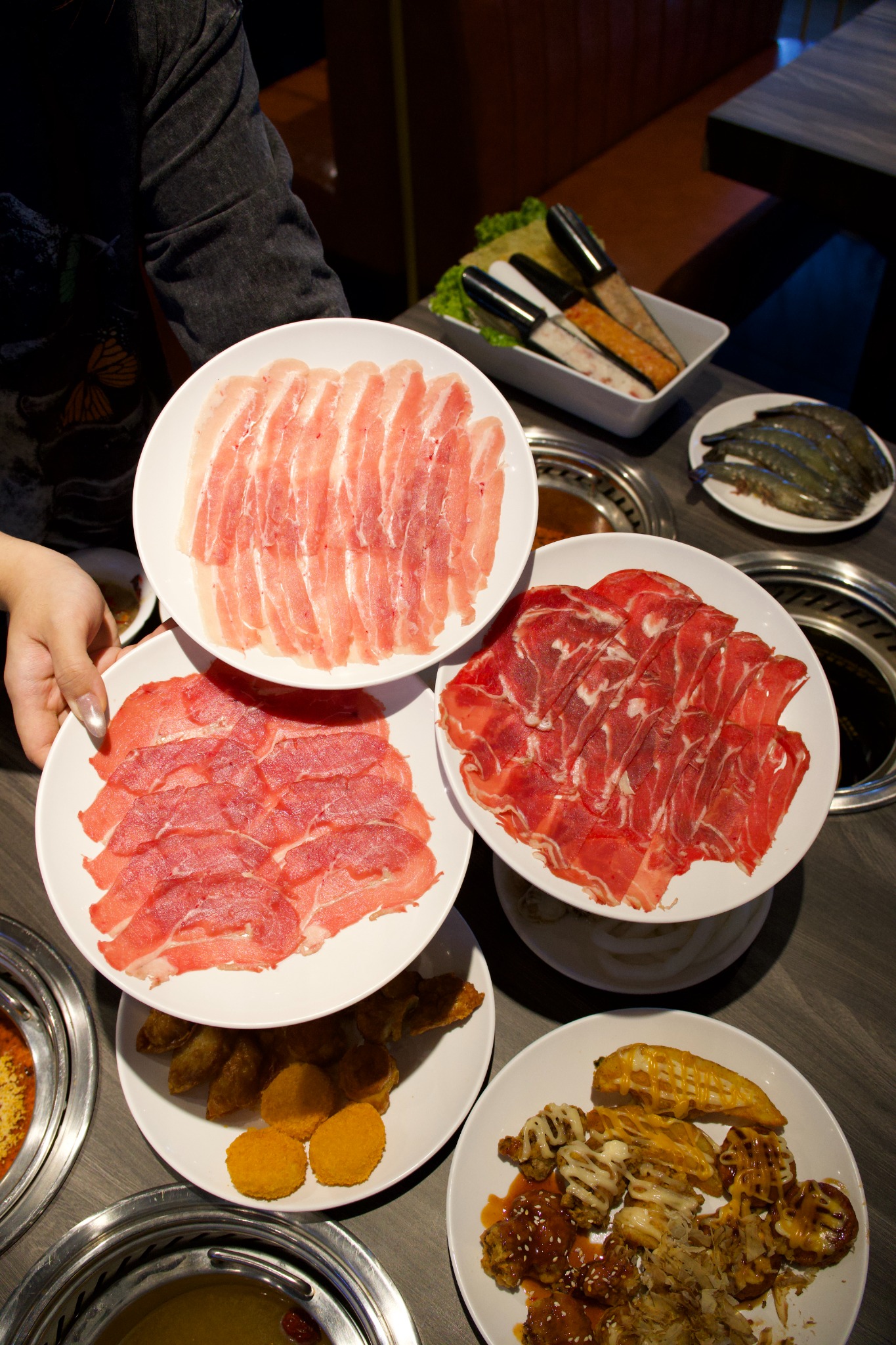 Stacked premium meat plates at Hot Pot Shabu Shabu